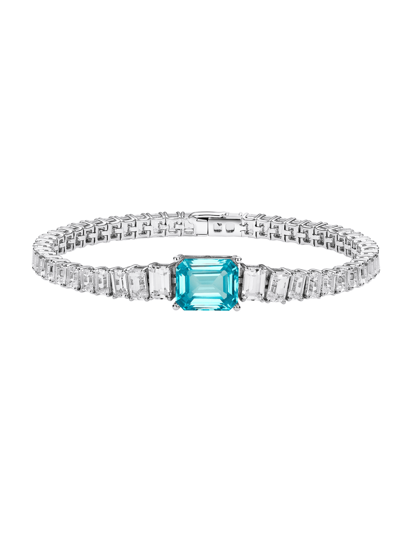 Sapphire emerald-cut tennis bracelet with hand-set setting detail view showcasing the jewelry design and finish