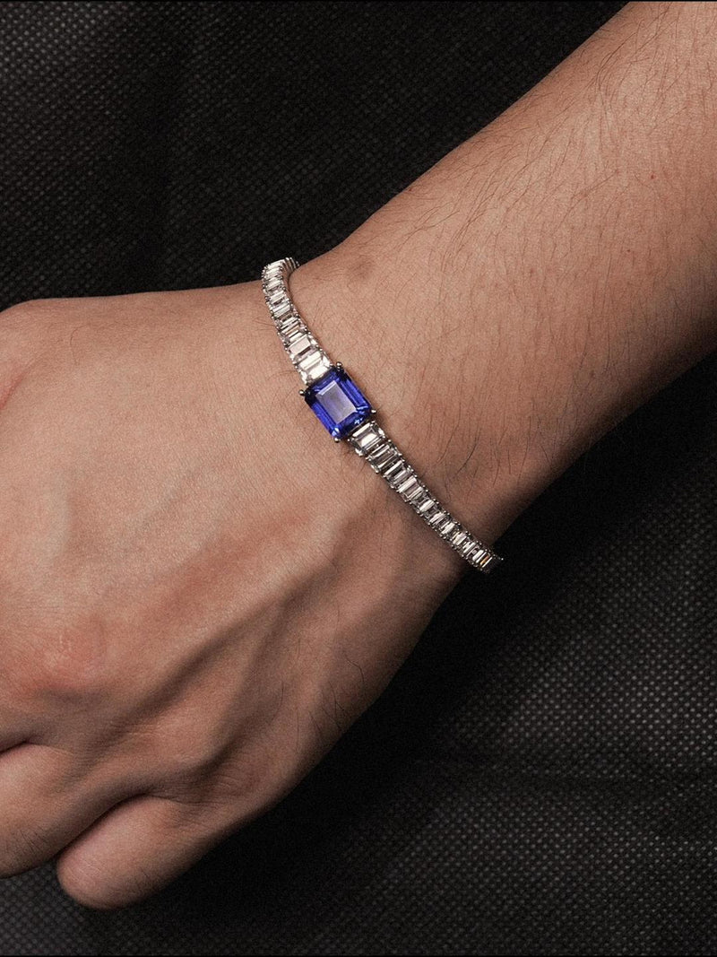 Padparadscha emerald-cut tennis bracelet with hand-set setting detail view showcasing the jewelry design and finish