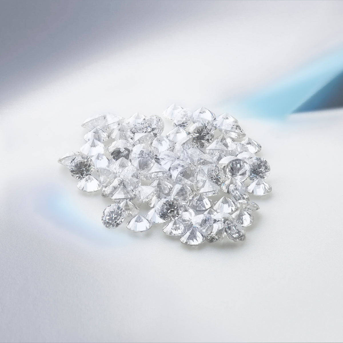 Colorless lab-grown diamond photographed against a neutral background