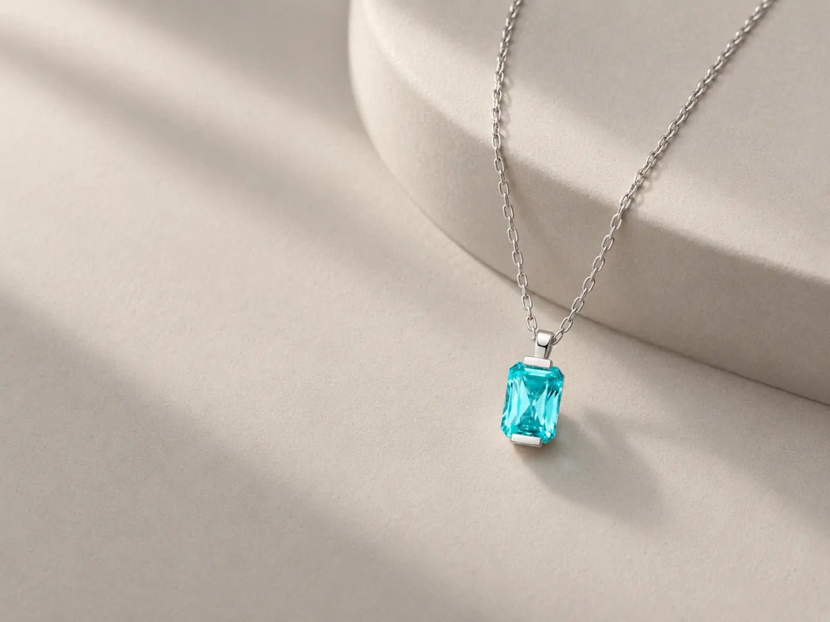 MAREA Paraiba Hue YAG necklace in a minimalist editorial setting