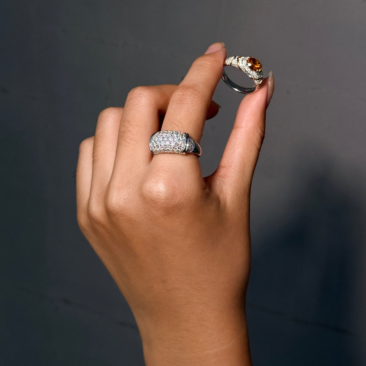 DUNE moissanite pav¨¦ dome ring shown on a raised hand