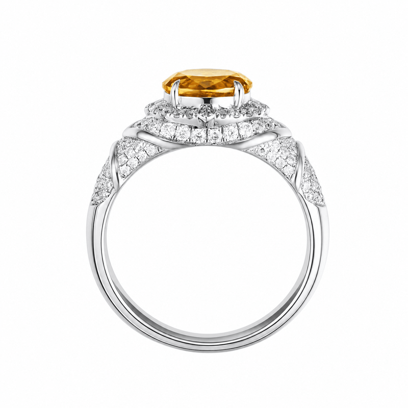 Padparadscha oval-cut ring with hand-set setting angled view showing the silhouette and craftsmanship
