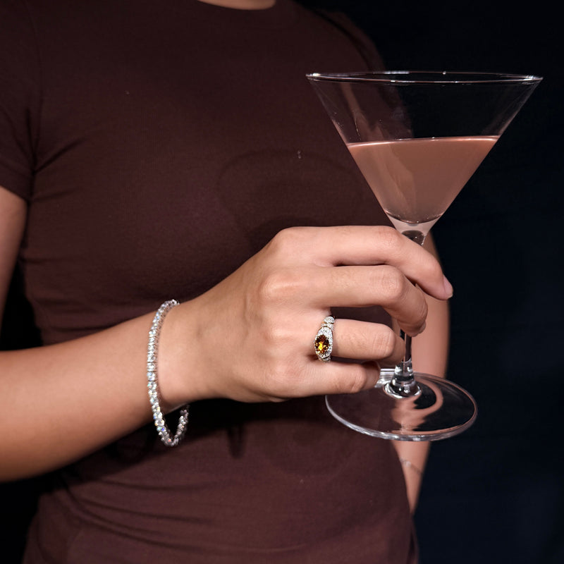 AUREL yellow east-west oval gemstone ring styled with a brown top and cocktail glass