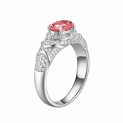 Hot pink sapphire oval-cut ring with hand-set setting detail view showcasing the jewelry design and finish