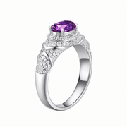 Padparadscha oval-cut ring with hand-set setting detail view showcasing the jewelry design and finish