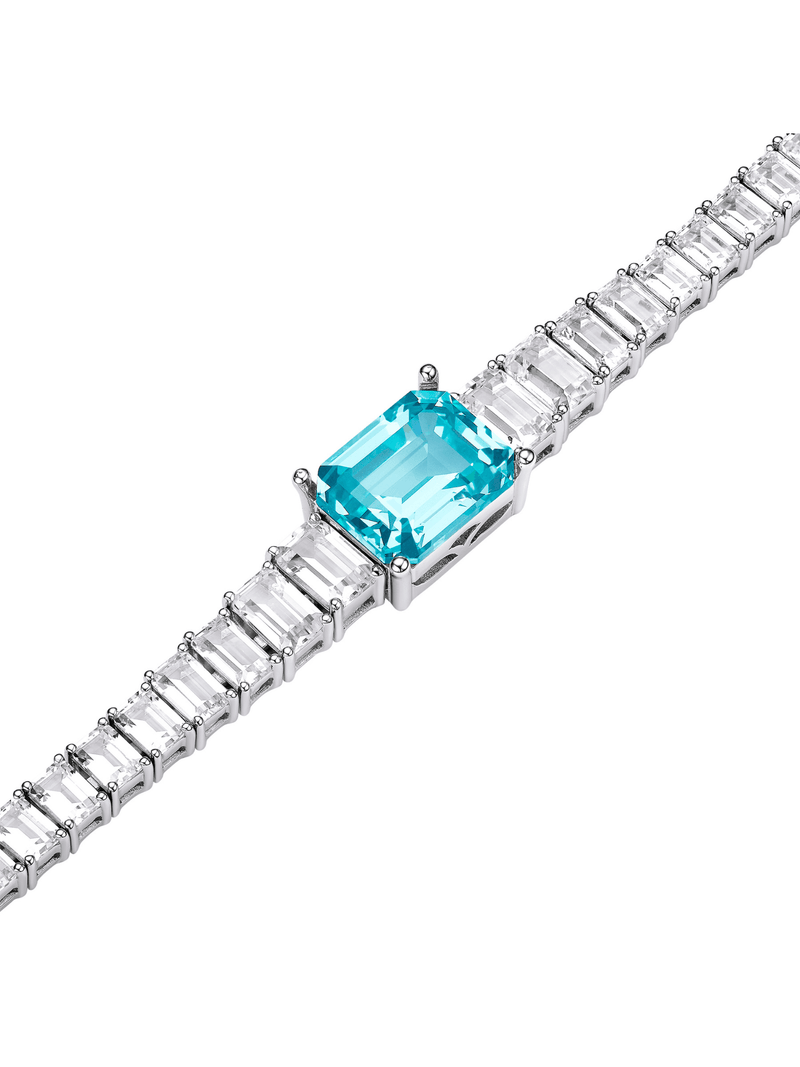 Sapphire emerald-cut tennis bracelet with hand-set setting detail view showcasing the jewelry design and finish
