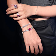 C?UR LAC pink lab-grown gemstone tennis bracelet stacked with a white gemstone bracelet, styled with black clothing.