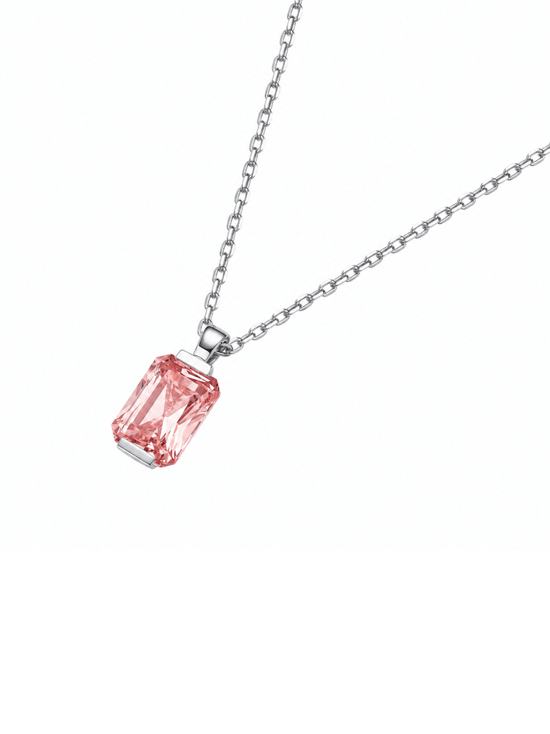 Hot pink sapphire radiant-cut necklace with hand-set setting detail view showcasing the jewelry design and finish