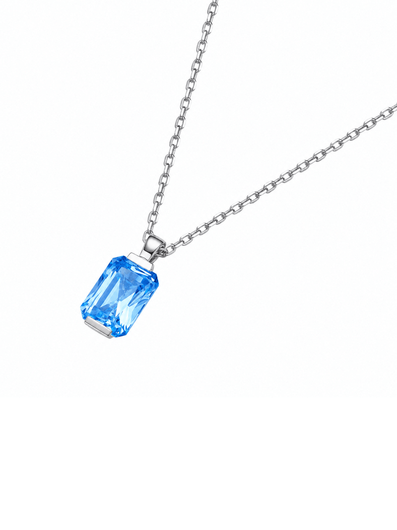Ruby radiant-cut necklace with hand-set setting detail view showcasing the jewelry design and finish