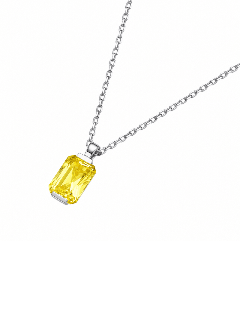 Hot pink sapphire radiant-cut necklace with hand-set setting detail view showcasing the jewelry design and finish