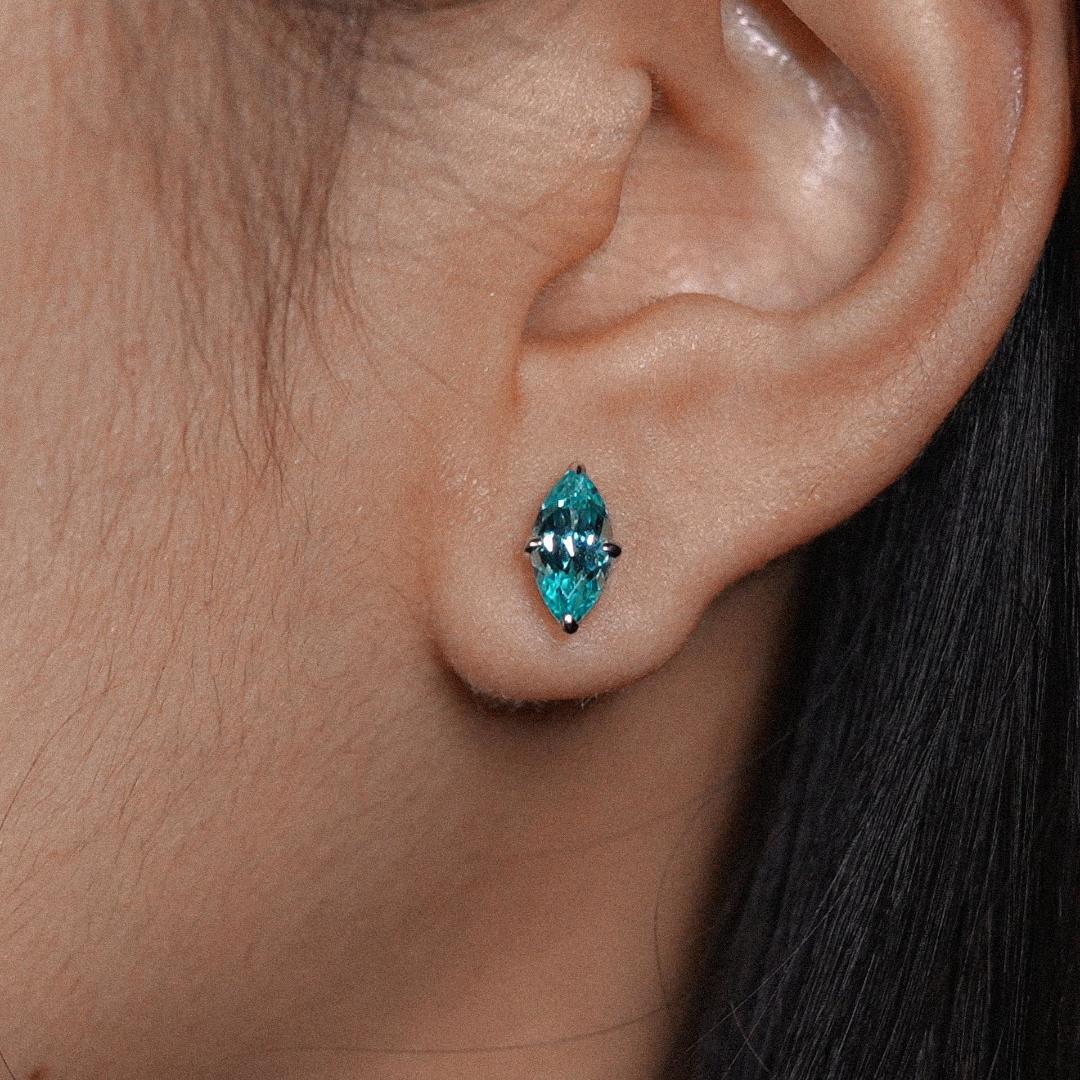 Sapphire marquise-cut earrings with hand-set setting close-up view highlighting the gemstone cut and setting details